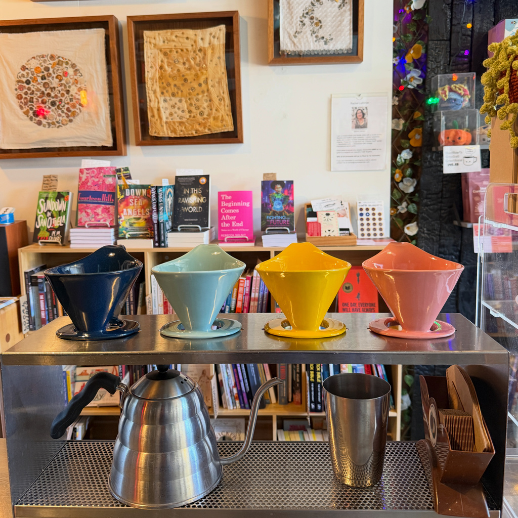 Coffee equipment and books at café suspiro